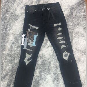 black ripped amiri jeans